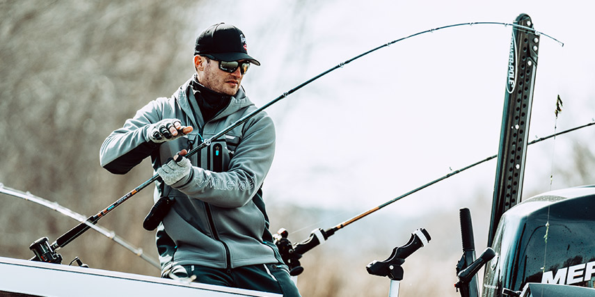 Korey Sprengel fishing while wearing the whitewater tamer jacket
