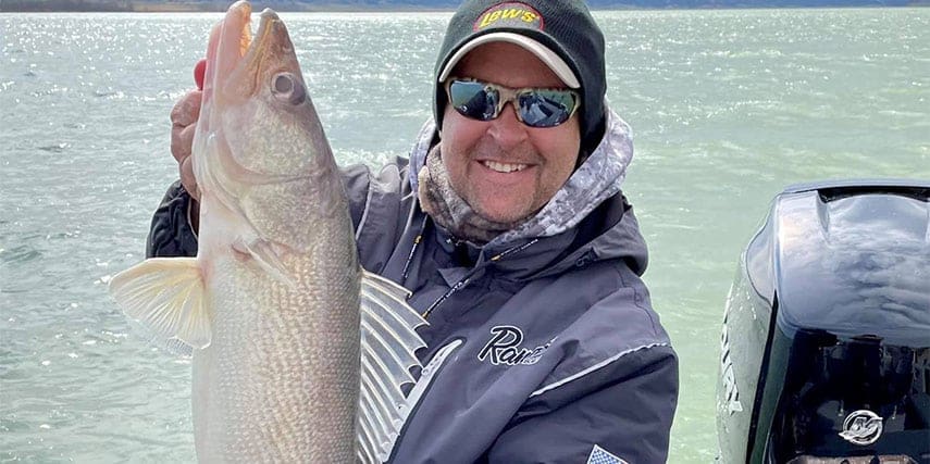 Jason Przekurat holding up a walleye