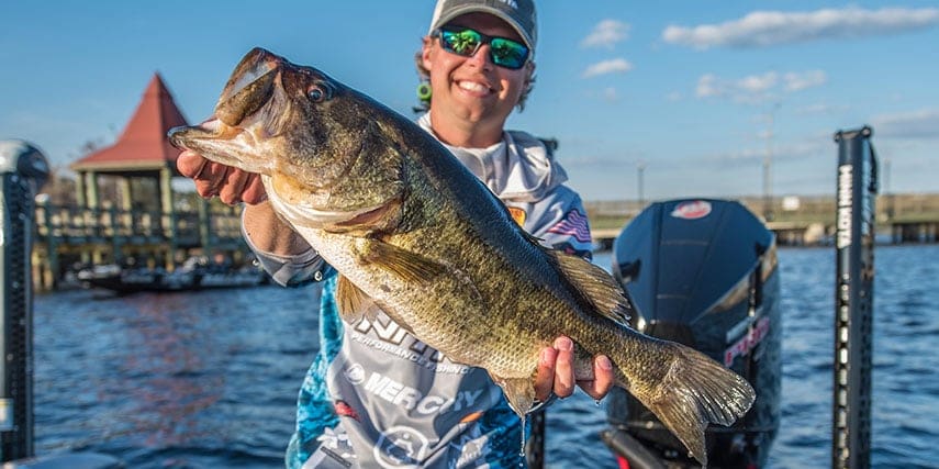 Whitewater Pro Jay Przekurat Elite Series Winner holding a bass