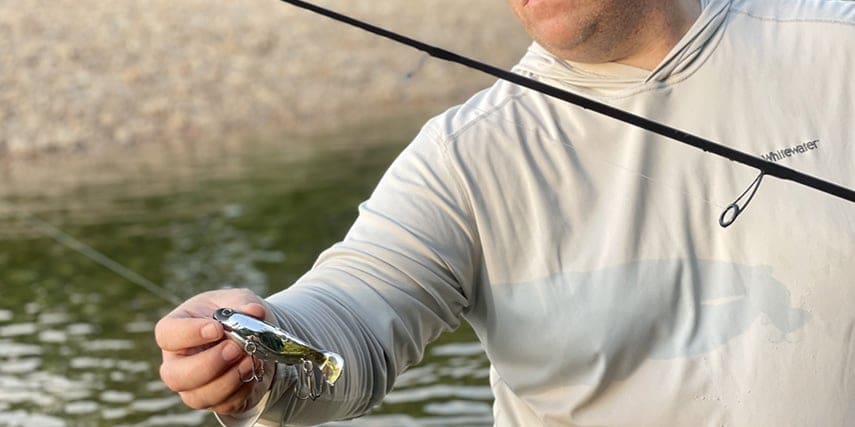 Heath Wood holding his fishing lure for all to see