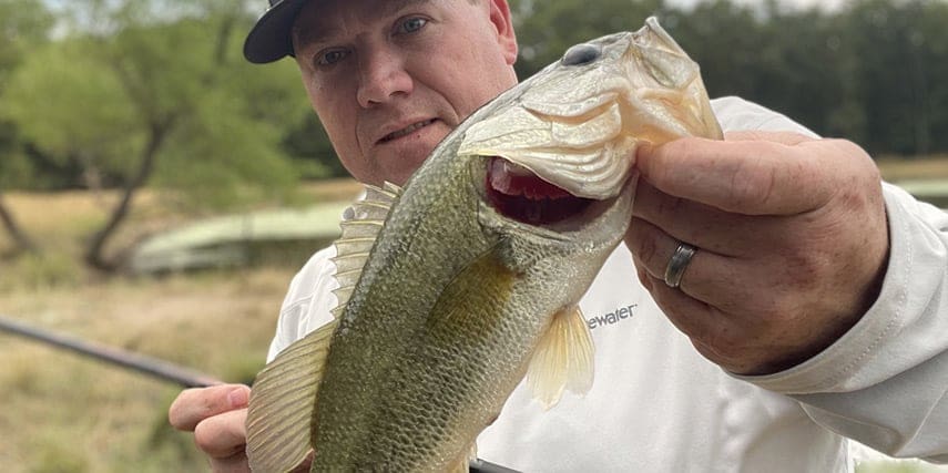 Heath Wood holding up one of his catches of the day