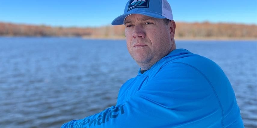 Heath Wood wearing Whitewater gear while fishing